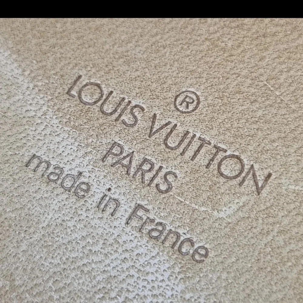 Louis Vuitton luxury brown suitcase
